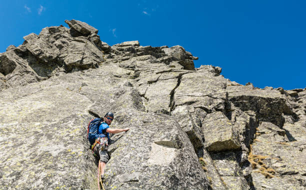 istock Climber in offwidth, while leading the pitch in the mountains. 959844080