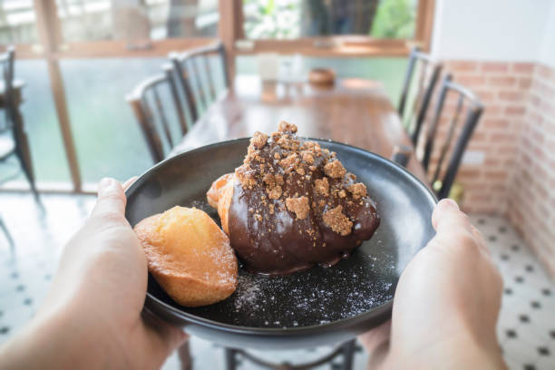 istock People hand hold plate serving fresh baked bakery 959847508
