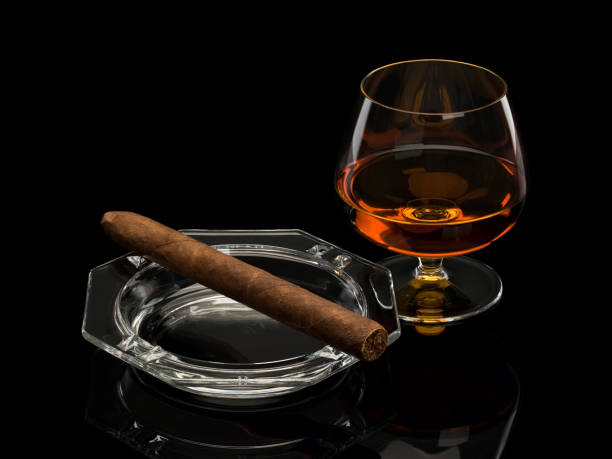 istock Cognac and cigar in a glass ashtray 959852532