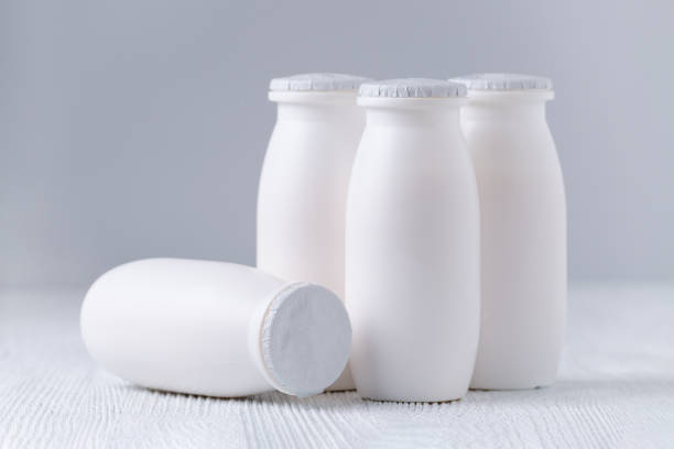 istock drink yogurt in plastic bottles on gray background 959854570