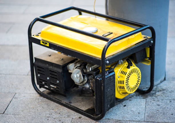 Gasoline Portable Generator on the House Construction Site. Close up on Mobile Backup Generator .Standby Generator - Outdoor Power Equipment stock photo