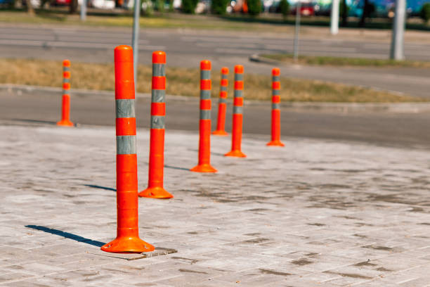istock Orange traffic pillar on the road and on parking lane. 959856066