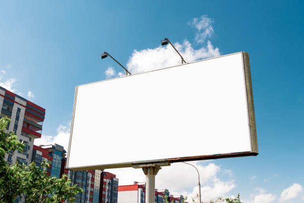 istock Billboard, billboard, canvas billboard, layout against the blue sky. The concept of outdoor advertising, marketing, sales. mockup 959856434