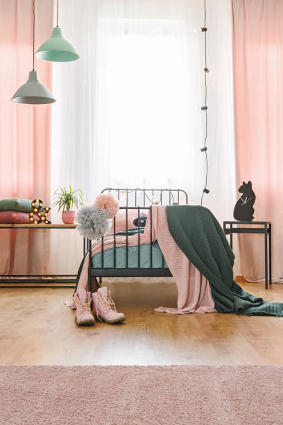 istock Industrial lights in girly bedroom 959860102