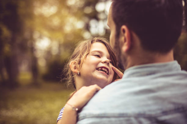 istock Father and daughter at park. 959862002