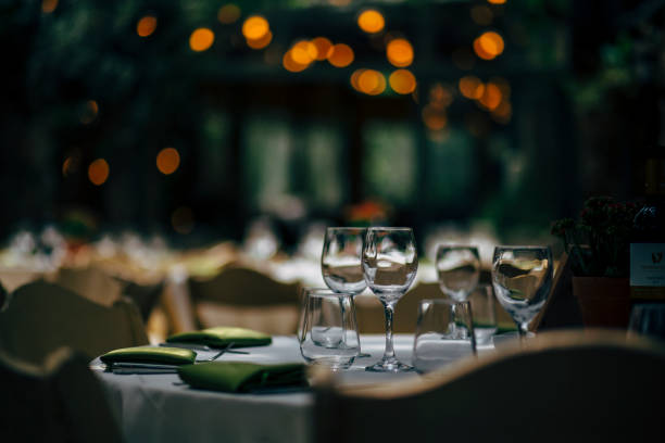 istock Luxury table settings for fine dining with and glassware, beautiful blurred  background. For events, weddings and other social events. 959862072