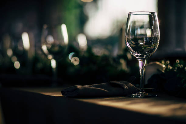 istock Luxury table settings for fine dining with and glassware, beautiful blurred  background. For events, weddings and other social events. 959864214