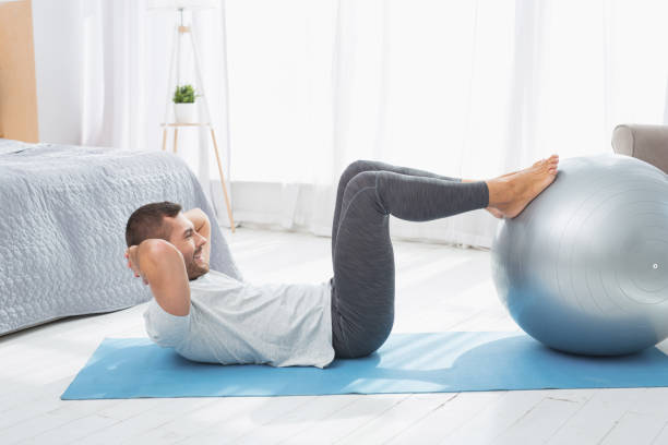 istock Positive healthy man exercising 959866434