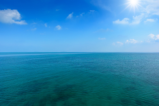 Tropical sea and blue sky with sun.