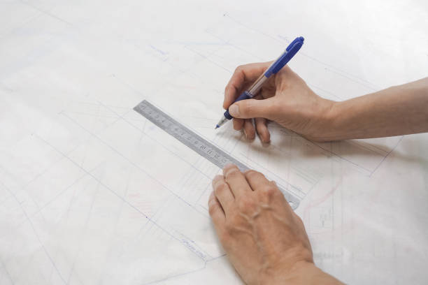 istock Drawing schemes on tracing paper. Tailor's business. 959866936