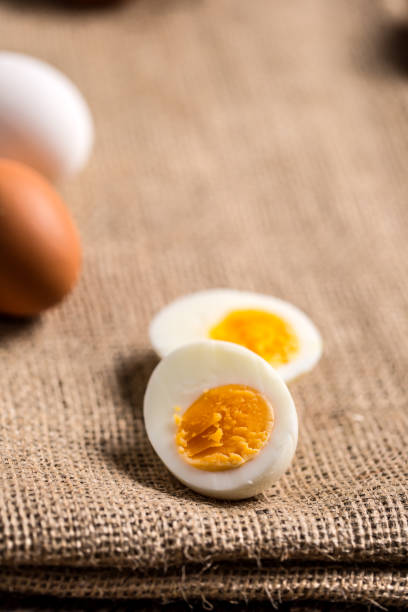 istock Close-up boiled or raw chicken eggs on wooden board 959868798