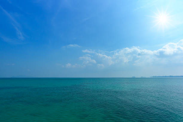 istock Tropical sea and blue sky with sun. 959873198