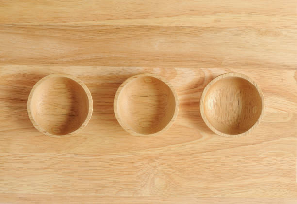 istock empty wood plate with three small bowl made from wooden 959873442