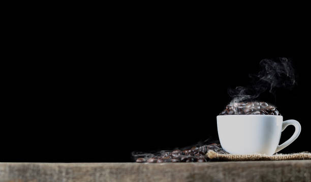 istock coffee beans in cup wish smoke black back ground 959873454