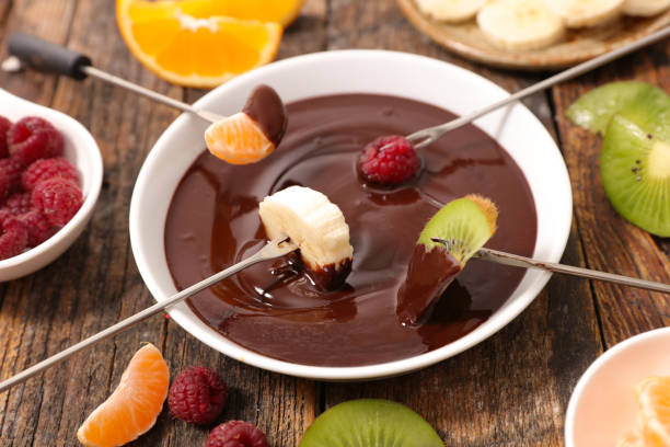 istock chocolate fondue and fruits 959873698