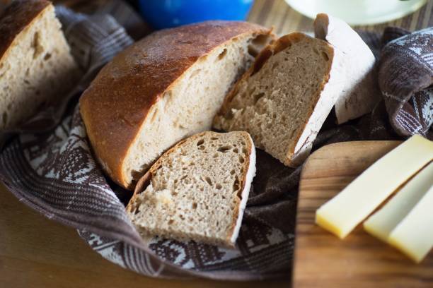 istock Bread and cheese on wooden board. 959874358