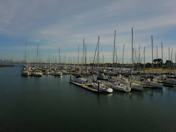 istock Boats in a marina against a blue sky 959879528