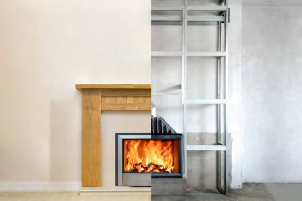 istock Modern fireplace in the apartment interior with real fire. Process installation 959879656