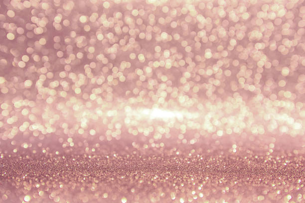istock Rose gold glitter, Defocused abstract holidays lights on background. 959881334