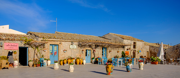 Craft shops in Piazza Regina Margherita, the main square of Marzamemi, a small maritime village located by the Ionian Sea coast.