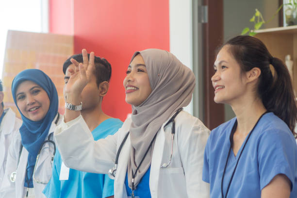 group of Malaysian medical staff having a meeting stock photo