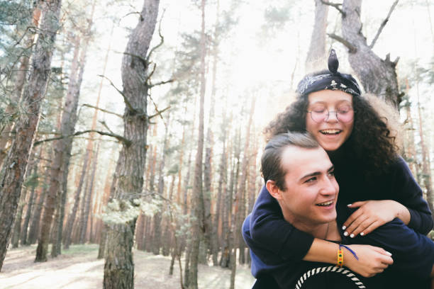 istock Happy young couple in the forest 959897744