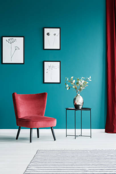 Paintings, armchair and table