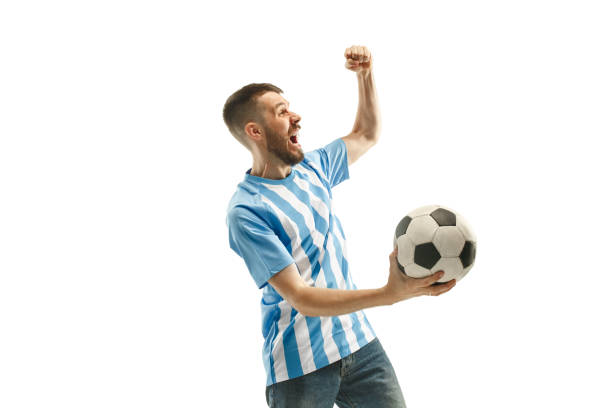istock The Argentinean soccer fan celebrating on white background 959901818