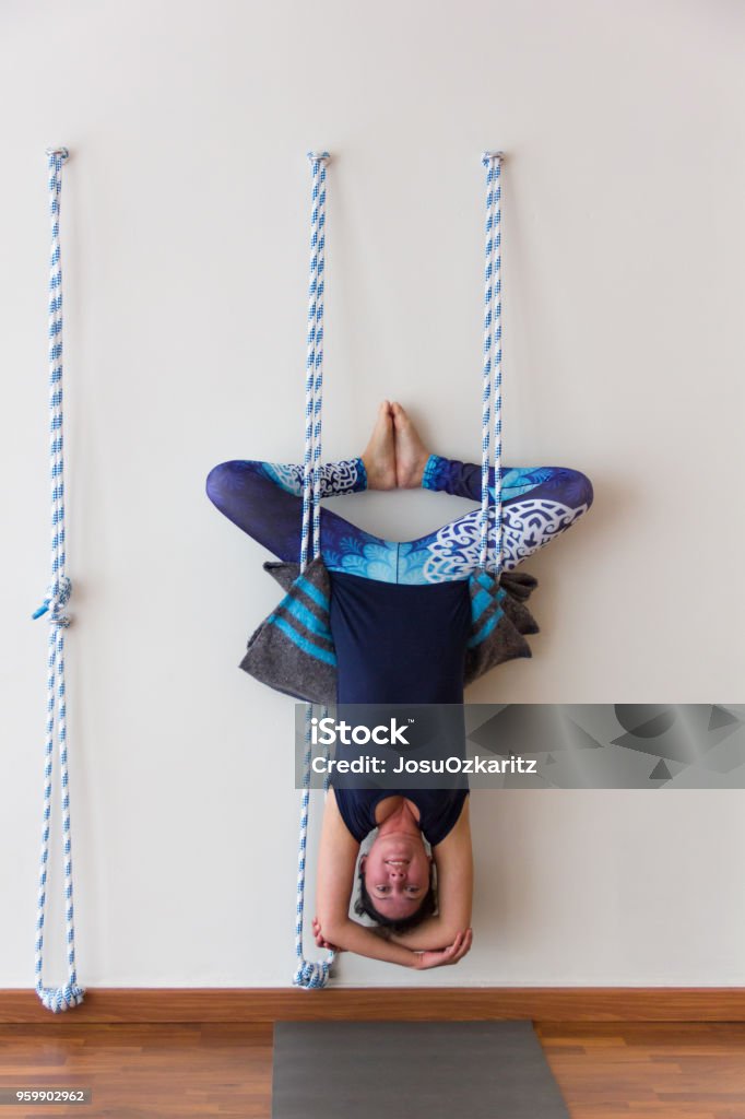 Iyengar Rope Inversion Iyengar Yoga Practitioner Hanging Upside Down From Ropes On White Wall ...