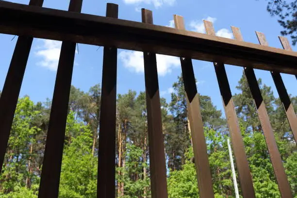 Low angle view of brown bars of gate