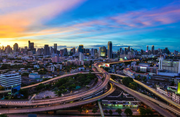 istock Twilight of Cityscape with highway interchange overpass 959906802