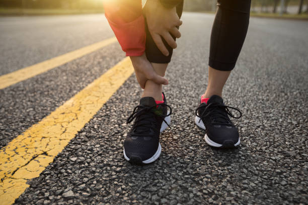 istock Woman runner with injured leg 959909670