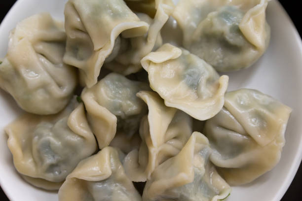 istock Asian dumplings stuffed with minced pork and vegetables 959910016