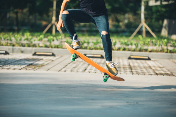 istock Skateboarder sakteboarding on parking lot 959910674