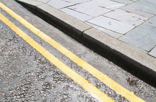 double yellow lines on road surface, UK , no parking yellow lines on road surface, UK indicating no parking no parking sign uk stock pictures, royalty-free photos & images