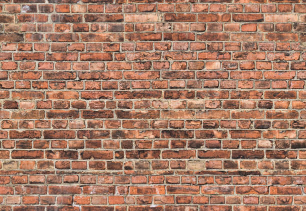 dark seamless background from old bricks stock photo