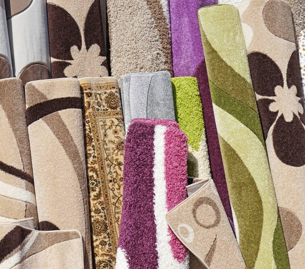 istock New carpets for sale in the warehouse 959915066