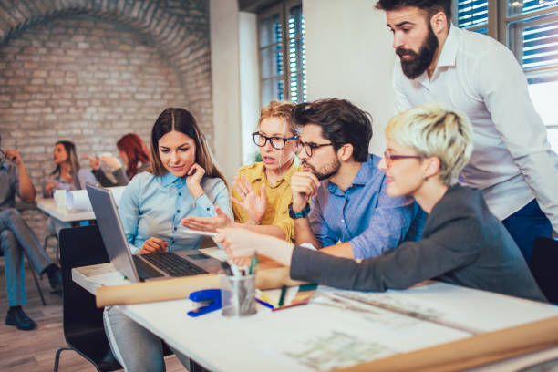 istock Business people working in office together. Team work in office. 959915340