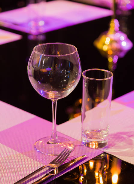 istock Table service in the restaurant. Transparent clean glasses and wine glasses 959915520