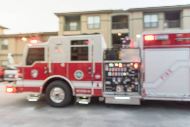 istock Abstract blurred fire trucks at apartment incident in Texas, USA 959920072