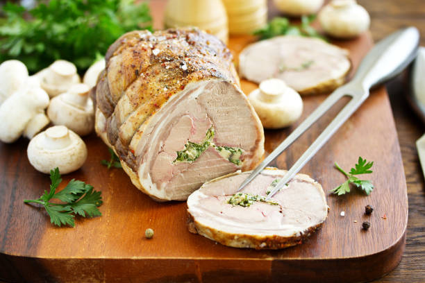 istock Rack of lamb stuffed with champignons and parsley. 959920130
