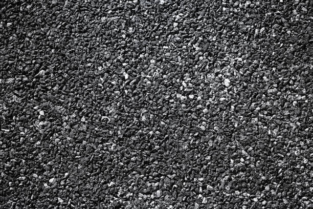 istock Asphalt pavement texture with small rocks High Resolution Background for highway backdrop design 959923024