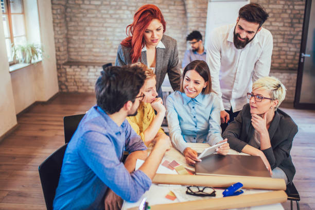 istock Business people working in office together. Team work in office. 959923192