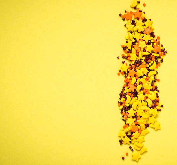 istock Colorful nonpareil on yellow background 959923694