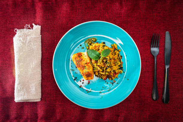 istock Andalusian fish, saffron rice with vegetables 959923954