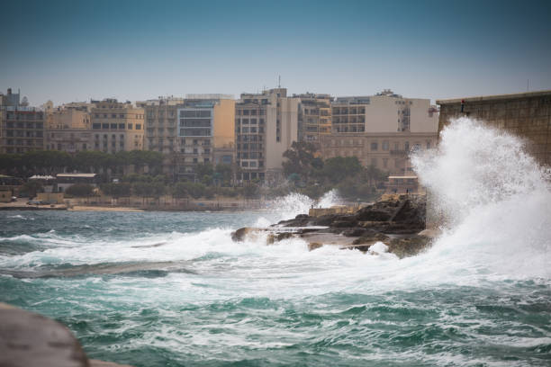 istock Huge waves crashing on the rocks 959928196