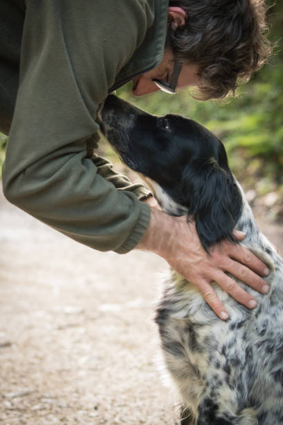 istock love and affection between man and his dog 959928278