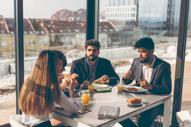istock Business people having breakfast in company restaurant 959928388