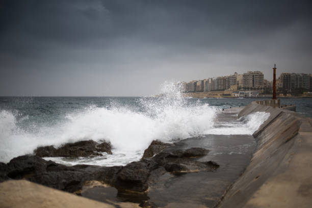 istock Huge waves crashing on the rocks 959928562