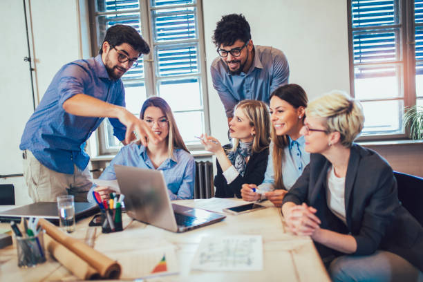 istock Business people working in office together. Team work in office. 959929370